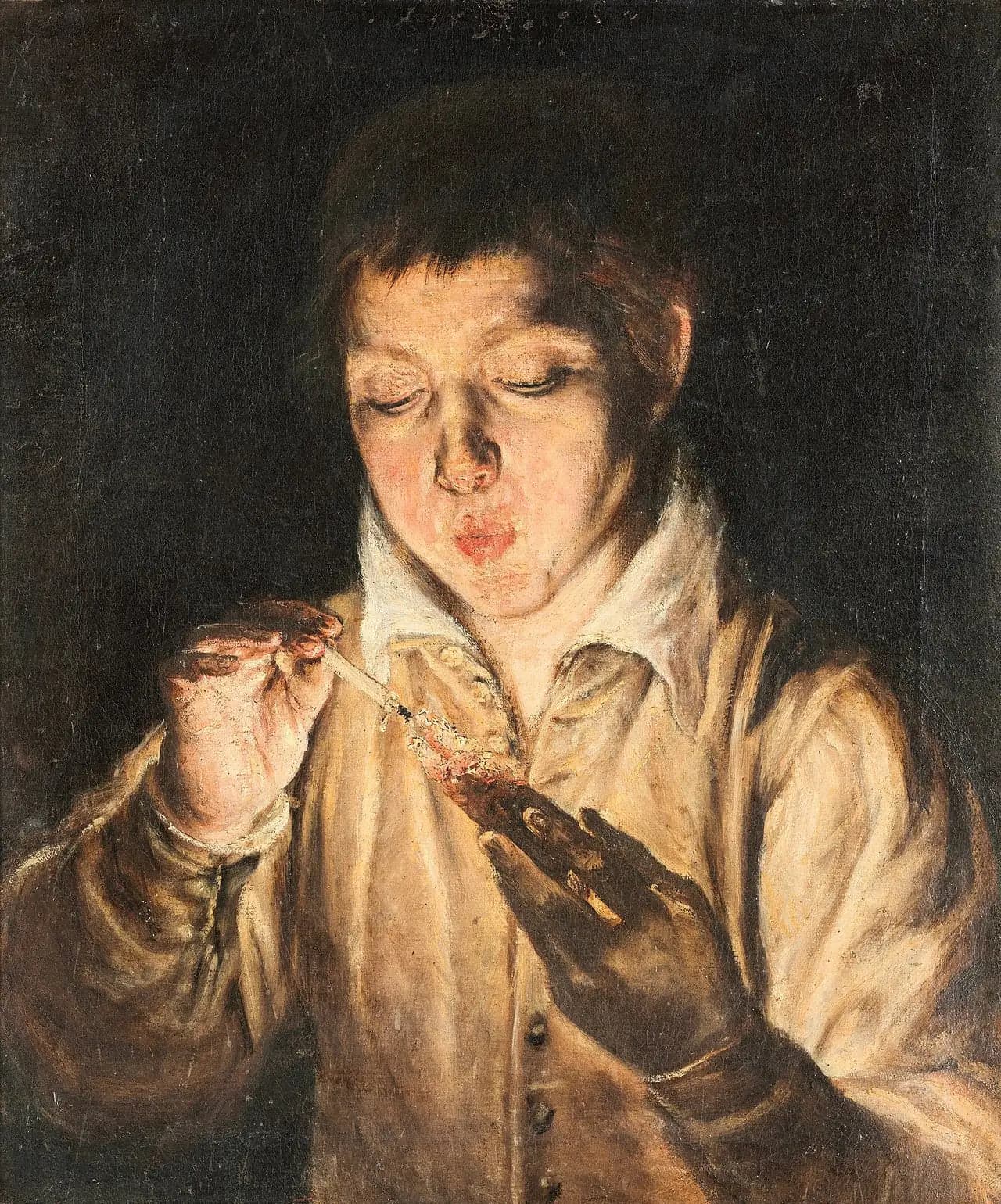 Young Boy blowing on a log