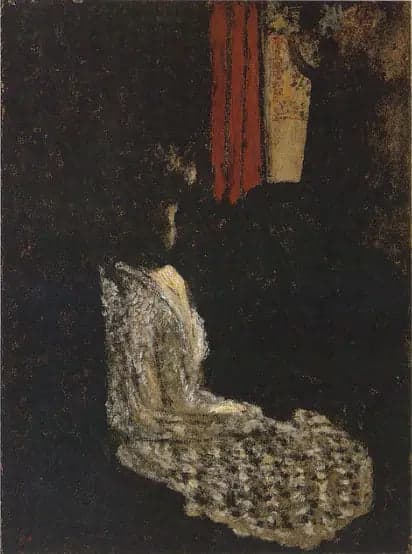 Woman sitting in a dark room