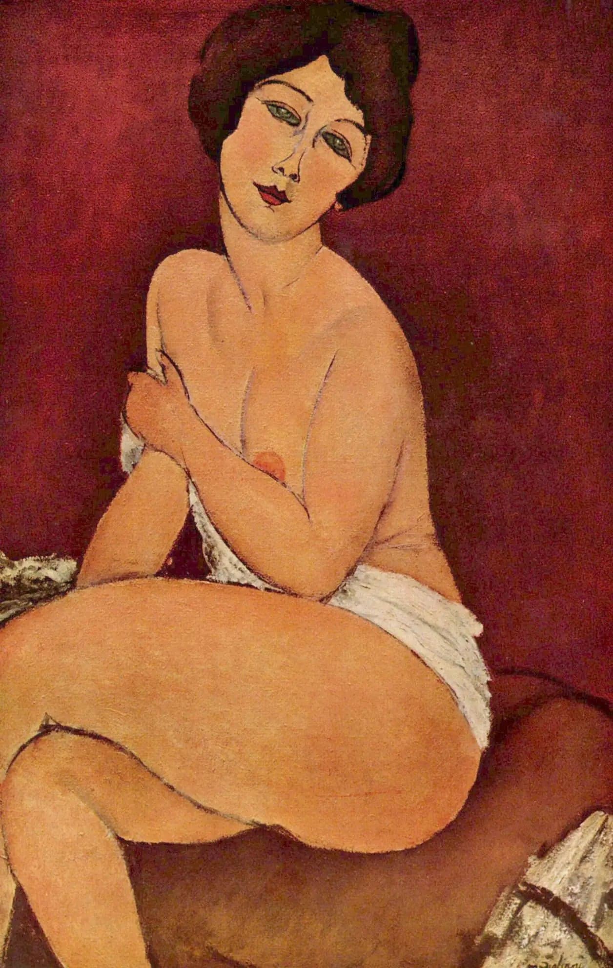 Female nude sitting on a sofa