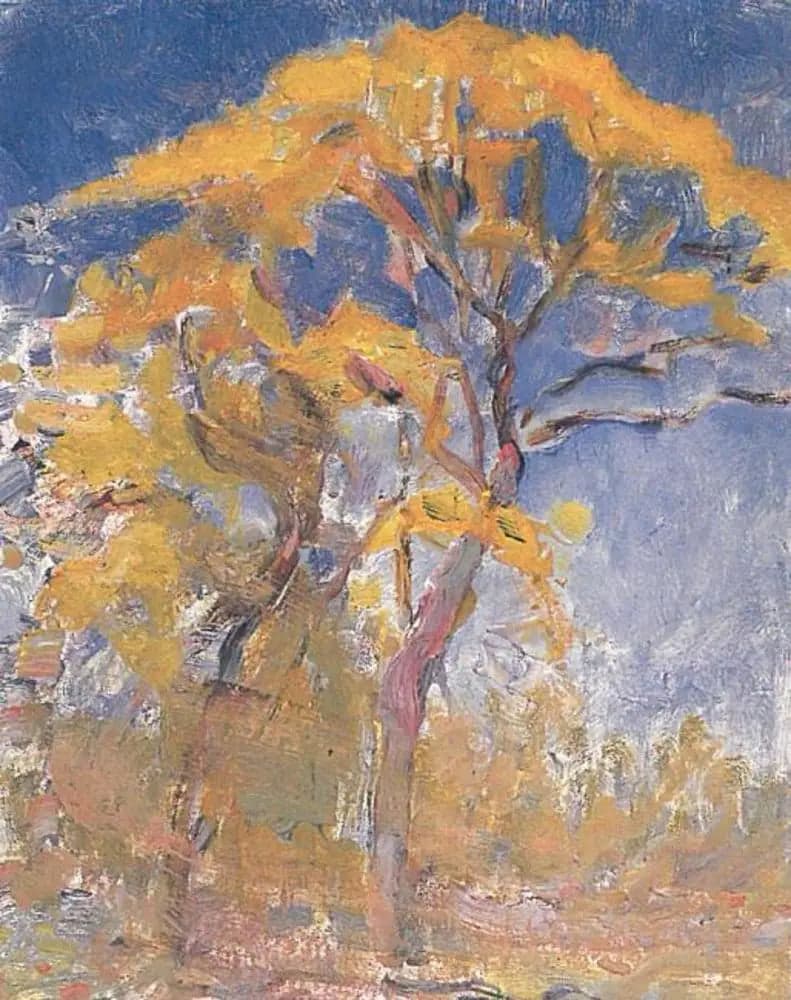 Two Trees with Orange Foliage Against the Blue Sky