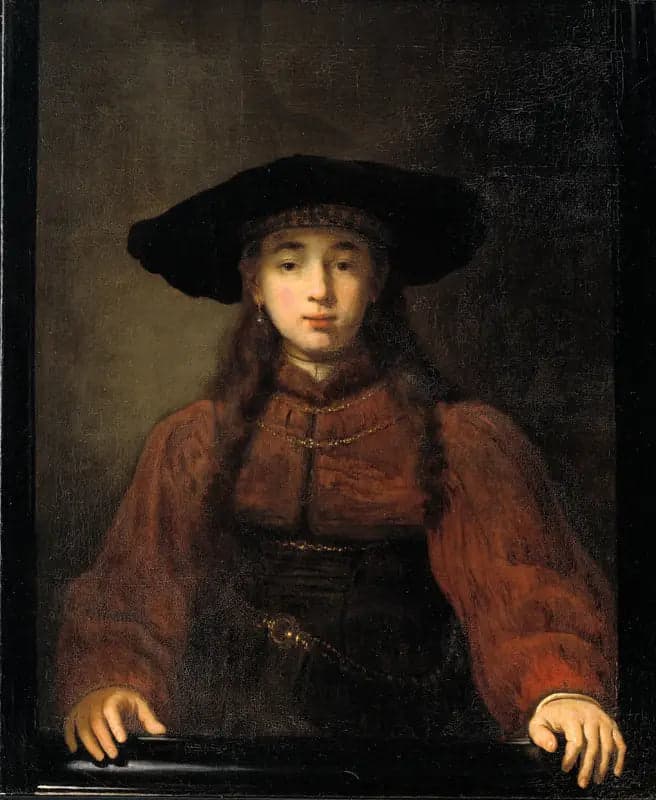 A young woman resting her hands on the picture frame