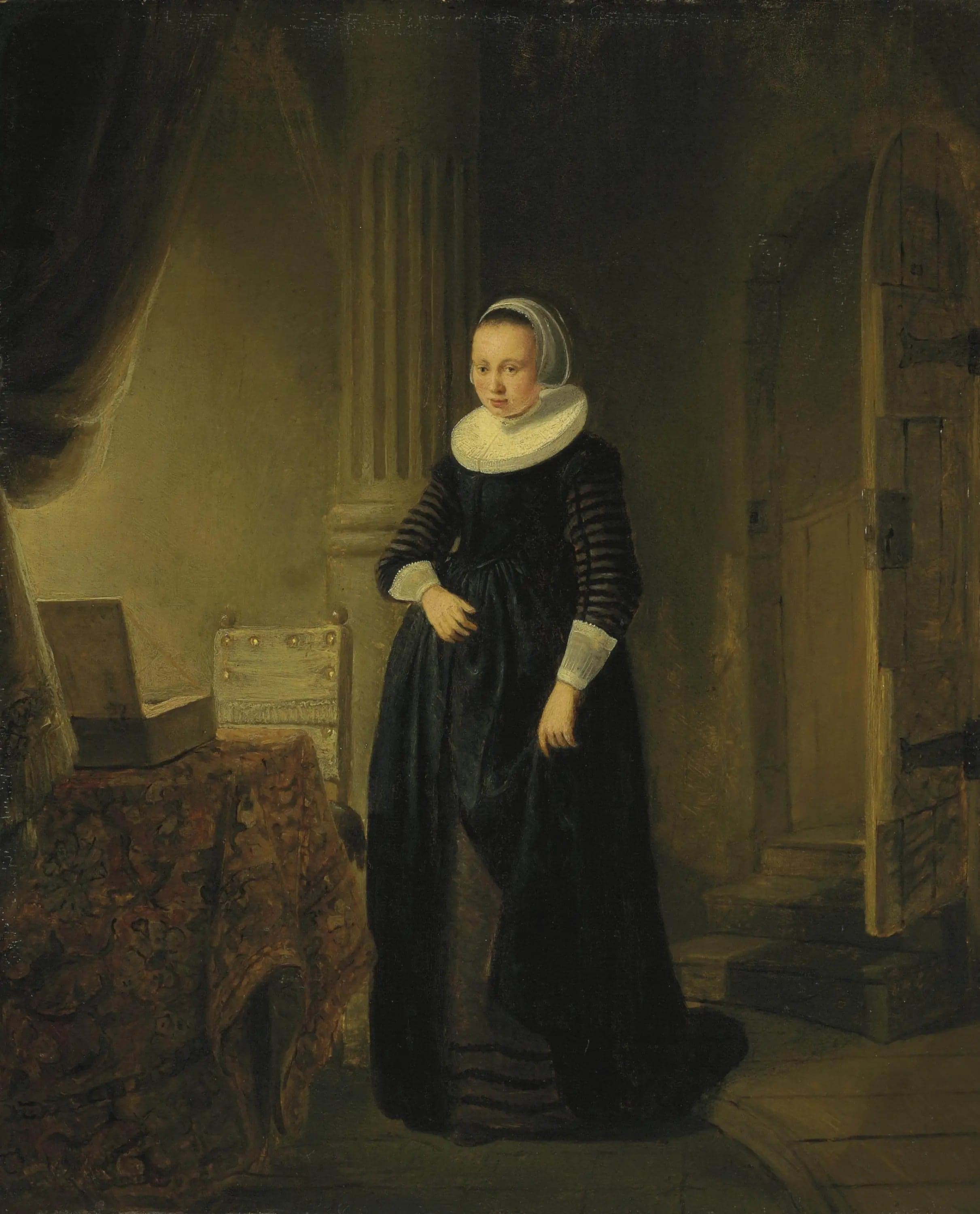 Portrait of a woman, standing full-length in an interior