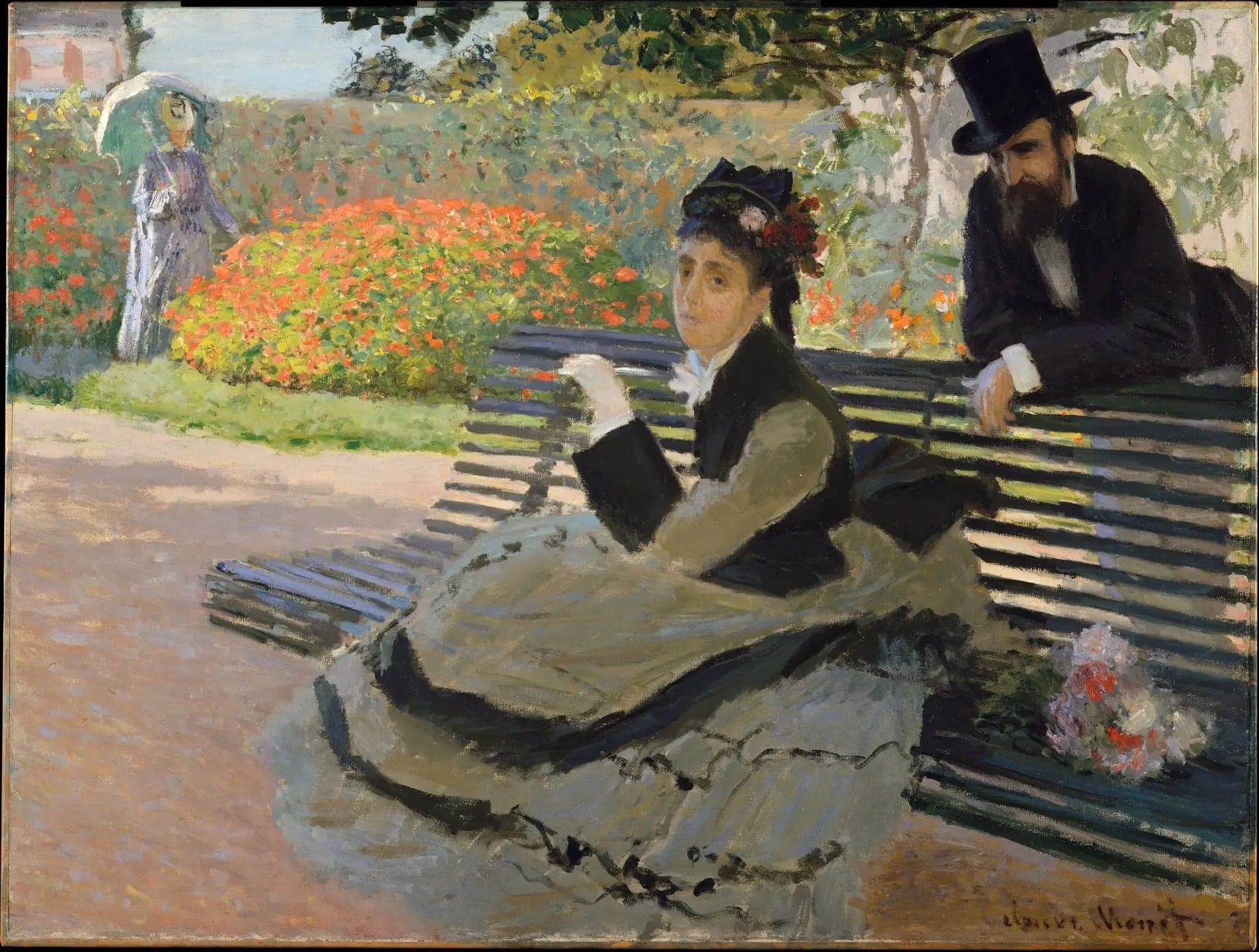 Camille Monet on a garden bench