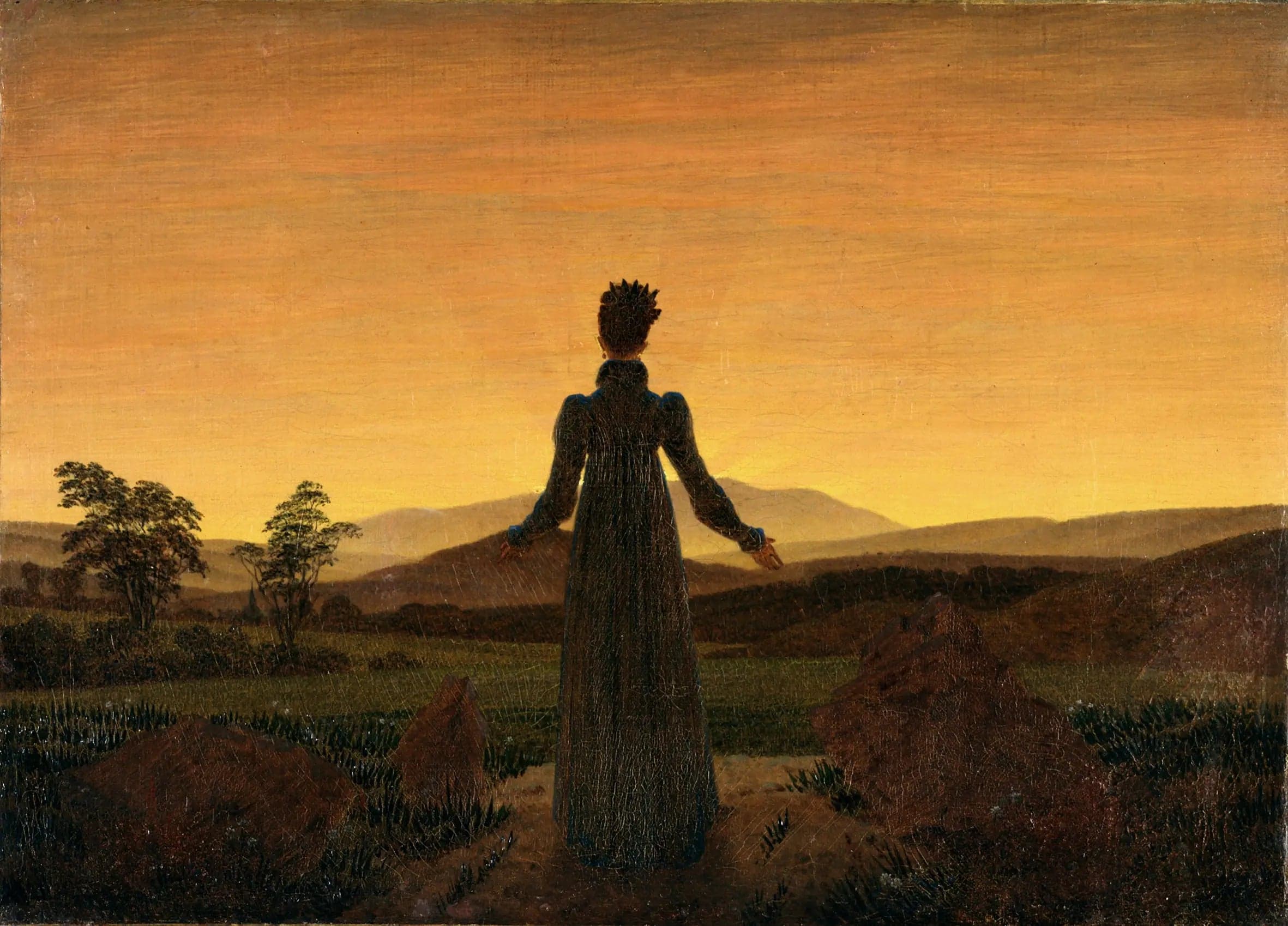Woman in front of the sunset