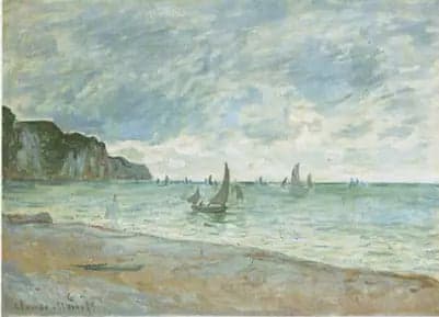 Fishing boats in front of the beach and cliffs of Pourville