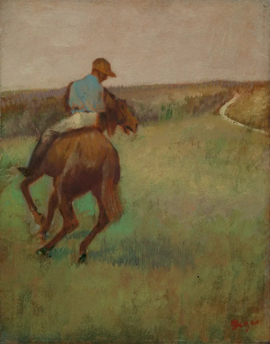 Jockey in blue on a chestnut horse