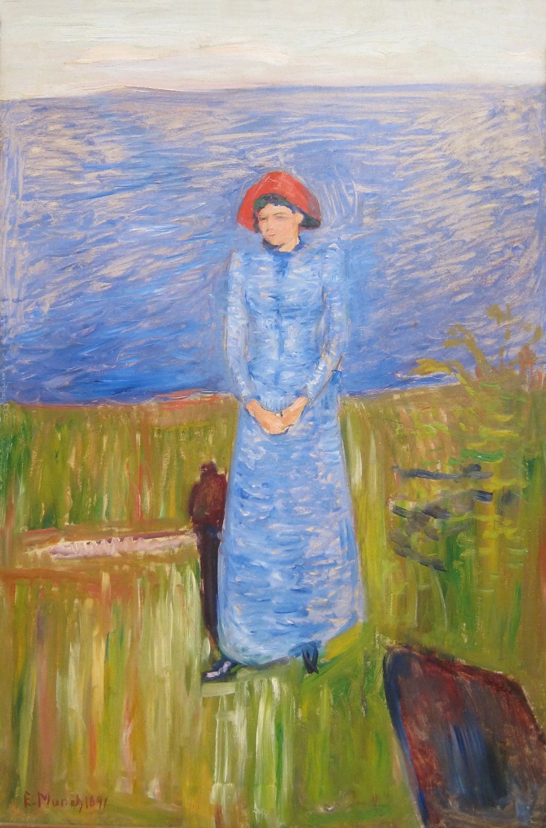 Woman in Blue in Front of a Blue Water