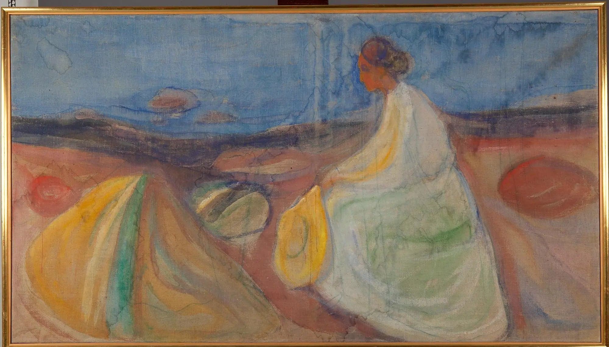 Woman in White Sitting on the Beach