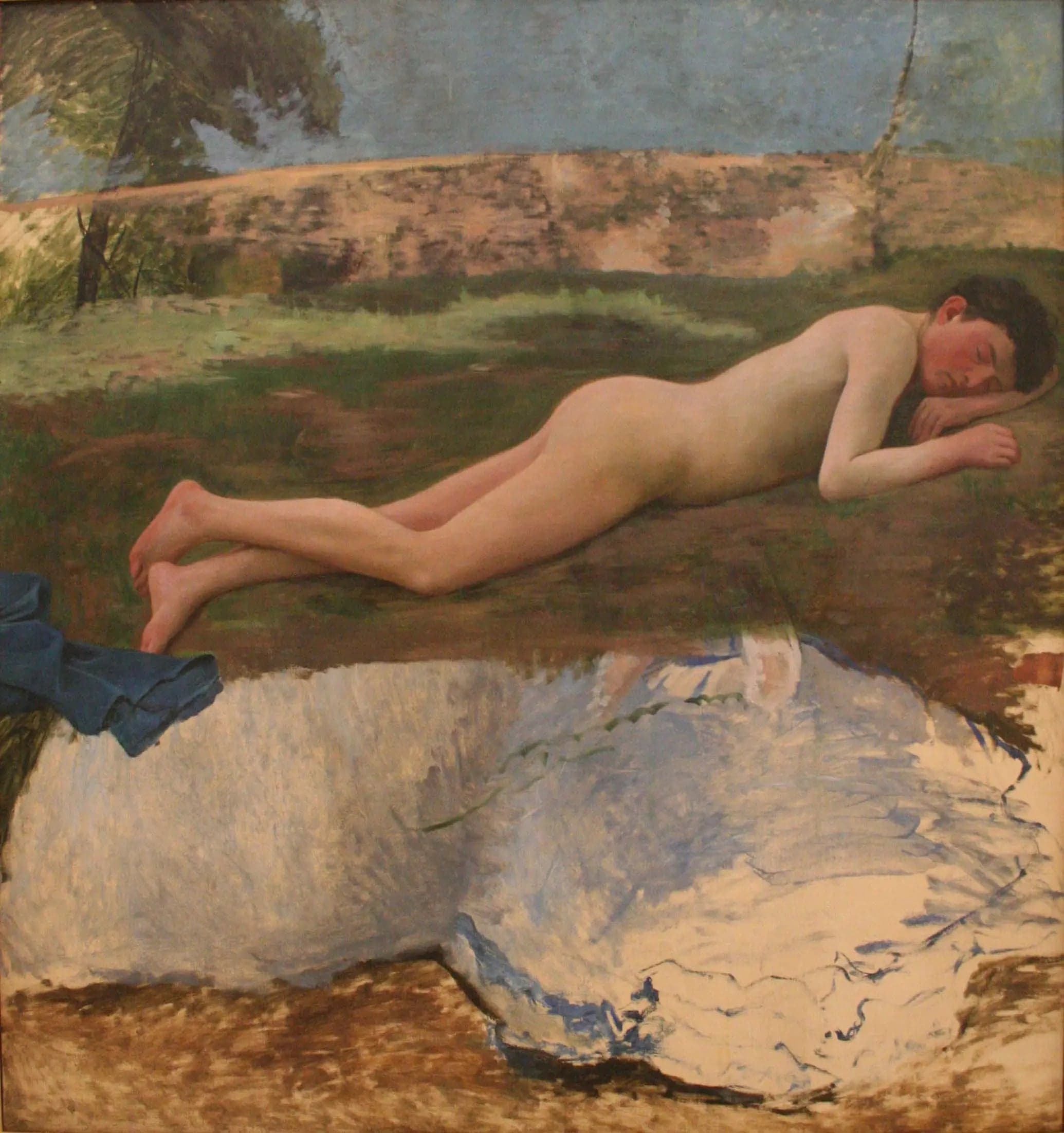 Young man nude lying on the grass