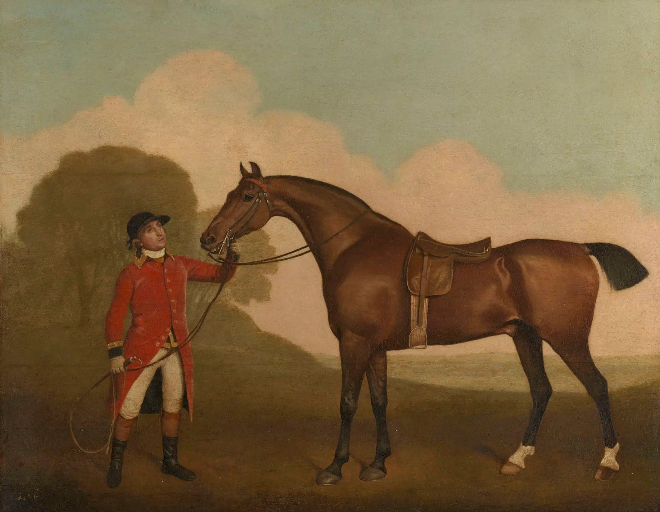 A bay horse with a groom