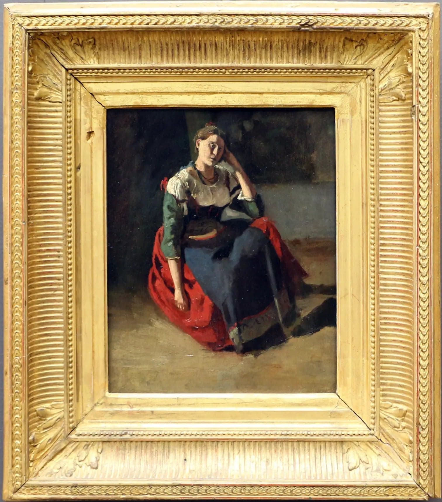 Italian woman sitting, leaning on her knee - Jean