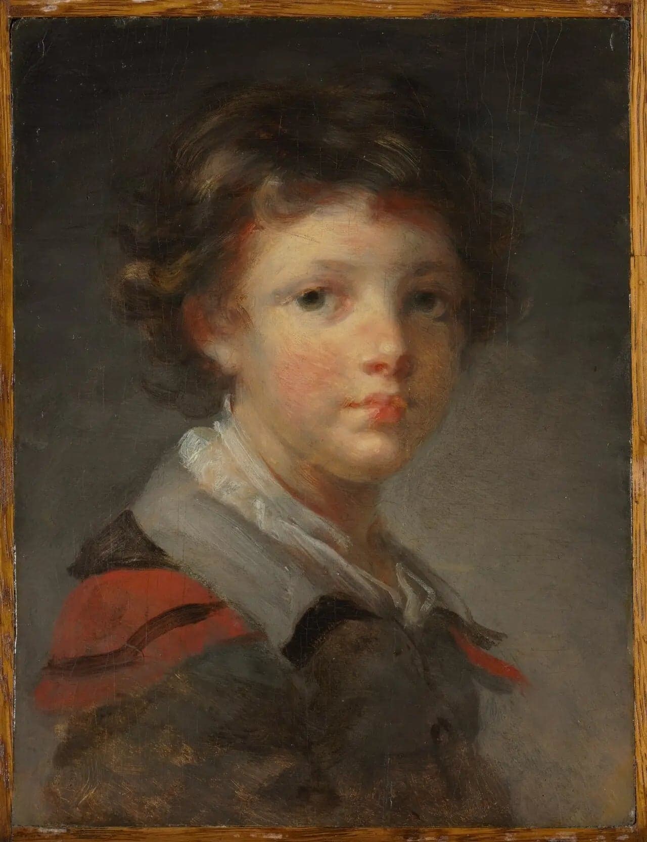 A boy in a red-lined coat - Jean