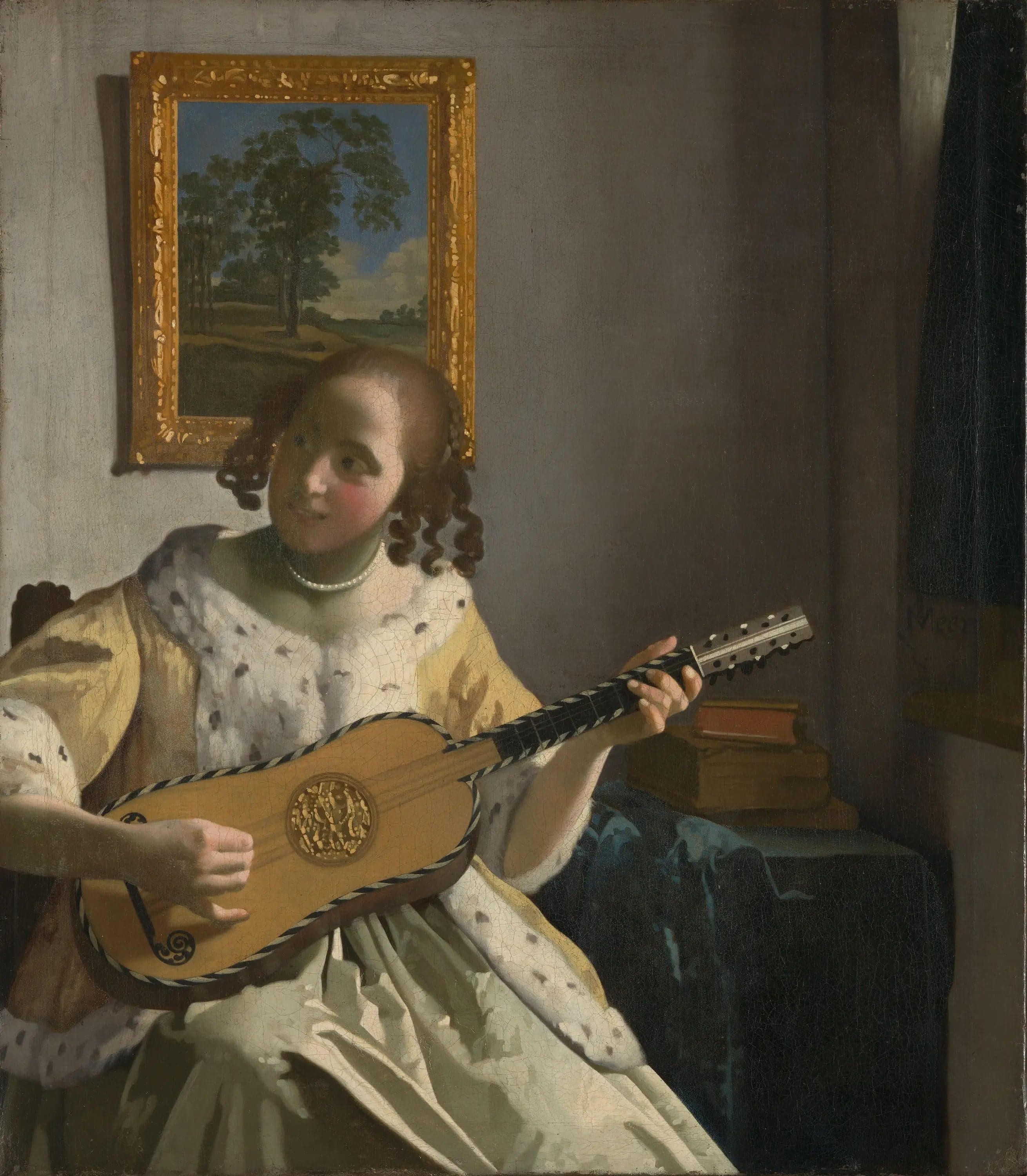 A woman playing the guitar