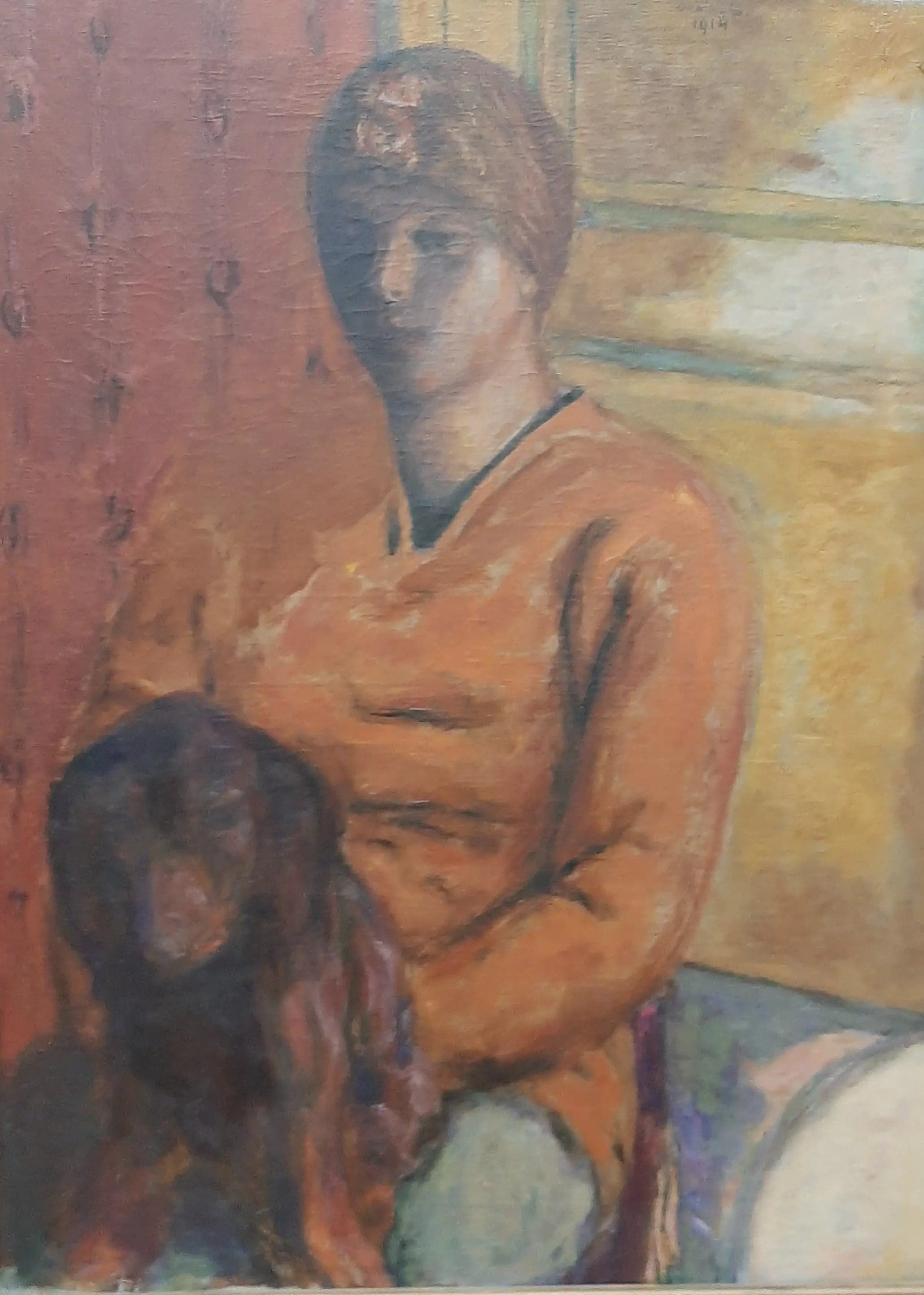 Woman Holding a Dog on Her Lap