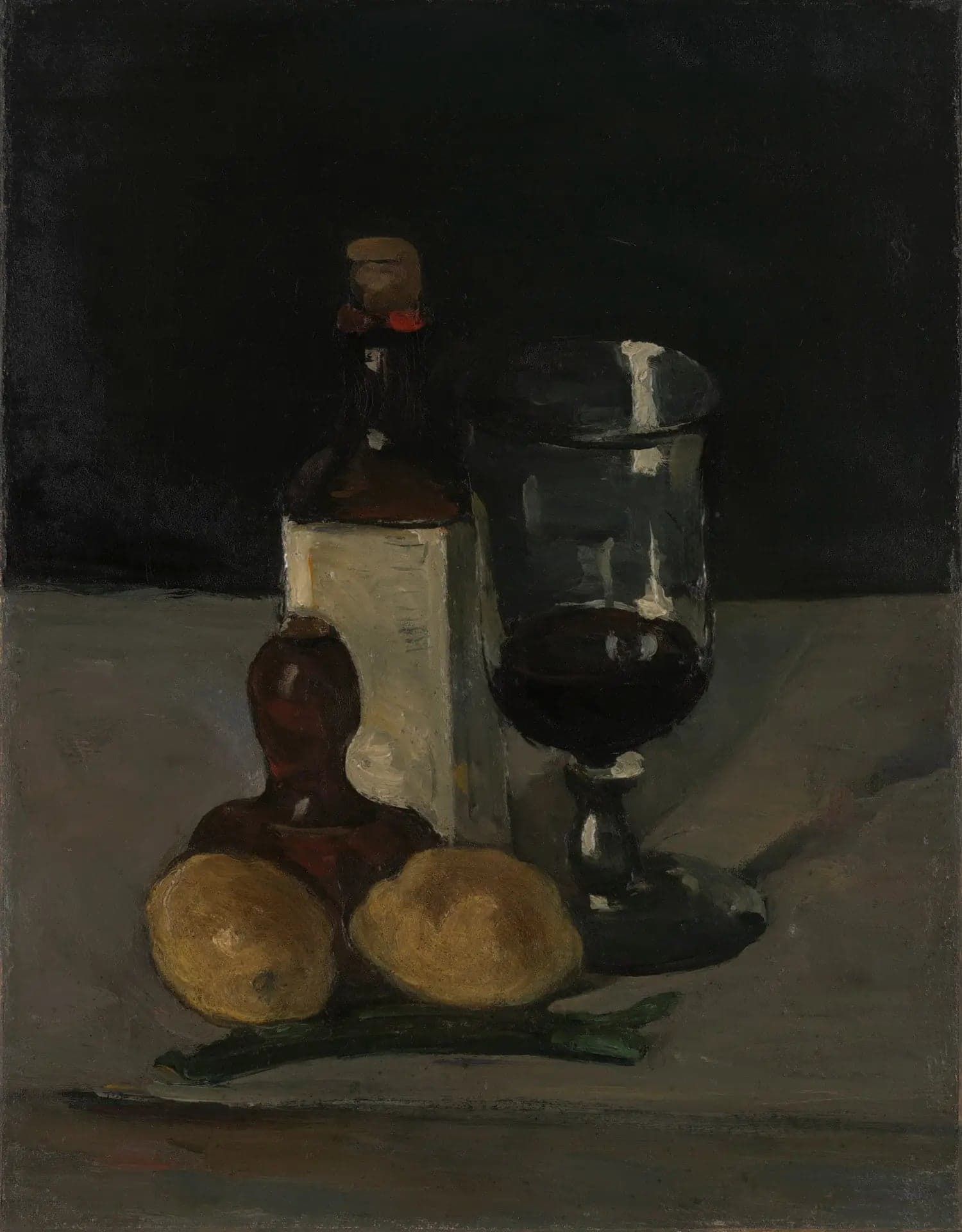 Bottle, glass and lemons