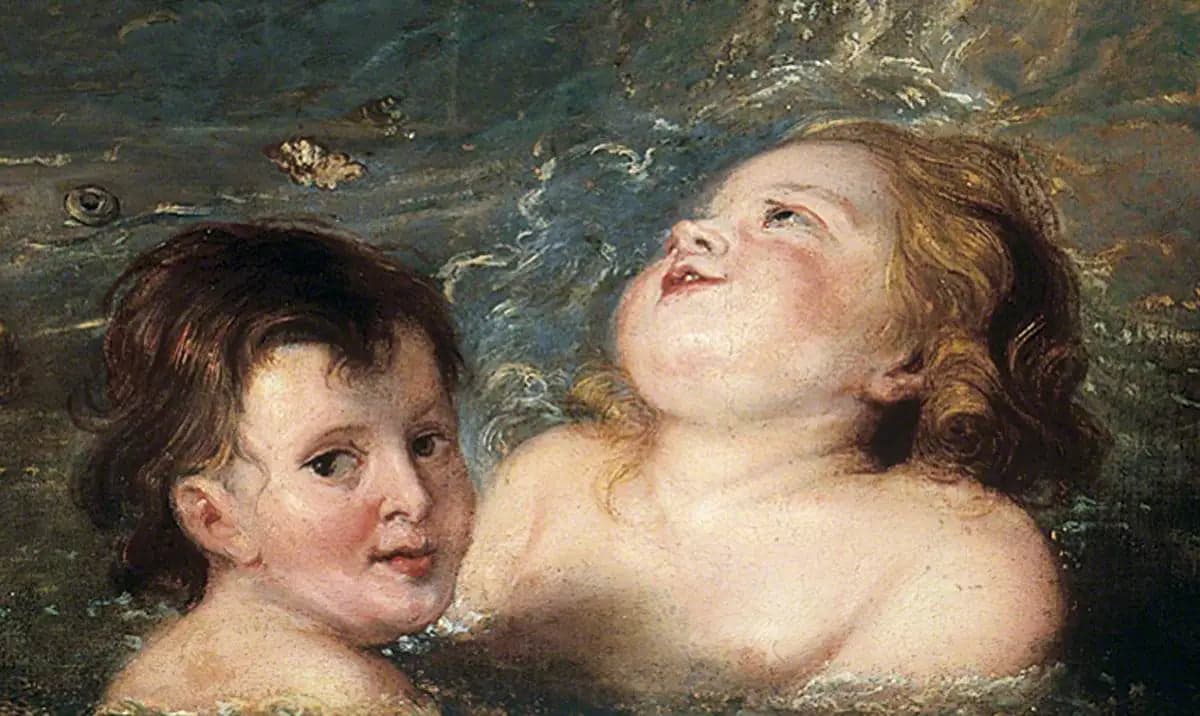Heads of two children bathing in the sea