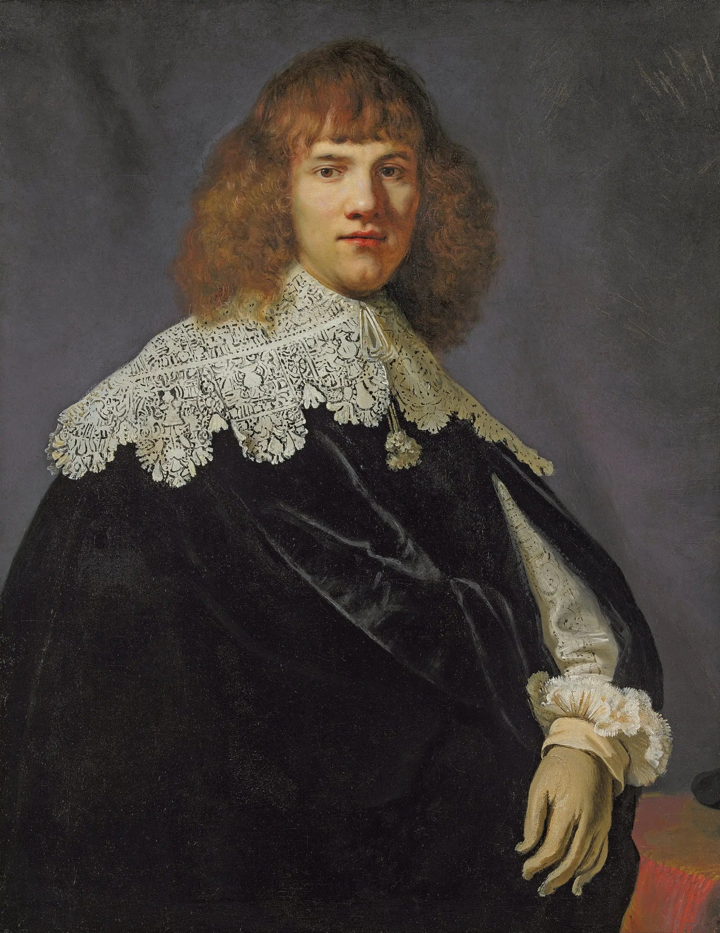 Portrait of a gentleman, half-length, dressed in a black velvet coat with a lace collar and cuffs