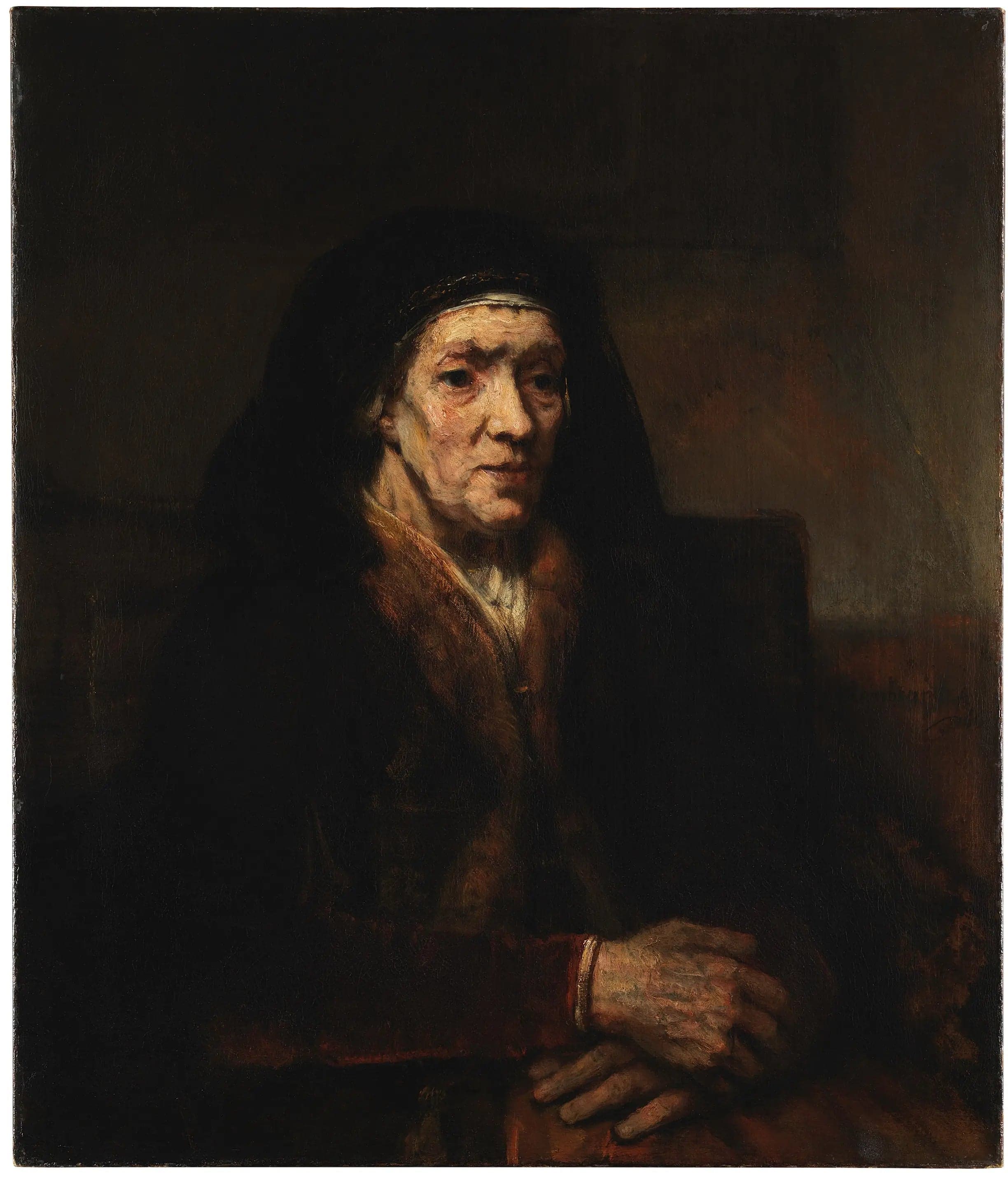 Portrait of a seated woman, hands clasped